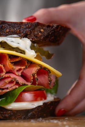 New York Style Deli Sandwich_portrait_Hero, close up+hand_side on_HR